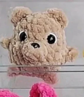 Beige miniature crochet teddy bear with rounded ears