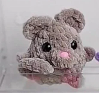 Gray mini crochet mouse with rounded ears and pink nose